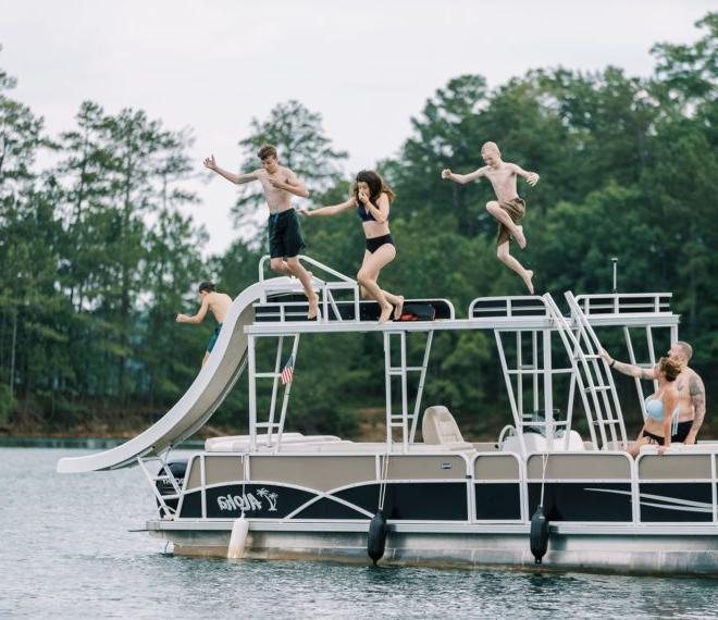 A family enjoying time on a lake in a boat